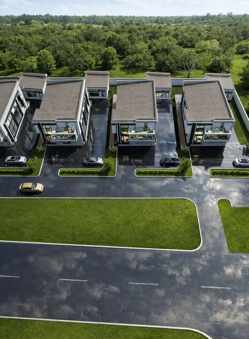 Aerial rendering of the Three of Us estate: flat-roofed duplexes set along a landscaped private road