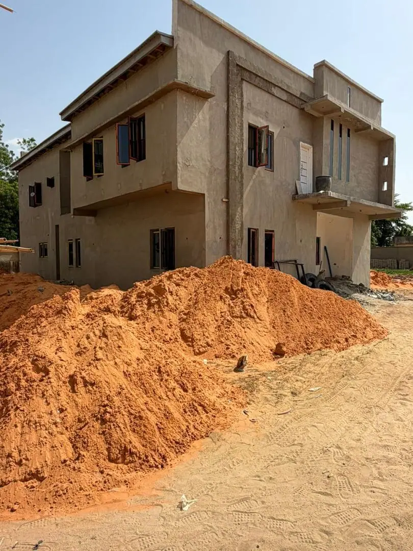 Two-storey AS5 Group duplex at plastering stage on an Abuja construction site